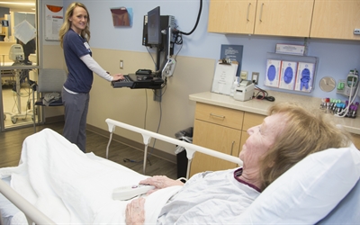 Nurse caring for senior patient in GEDA accredited ER at Missouri Baptist Medical Center